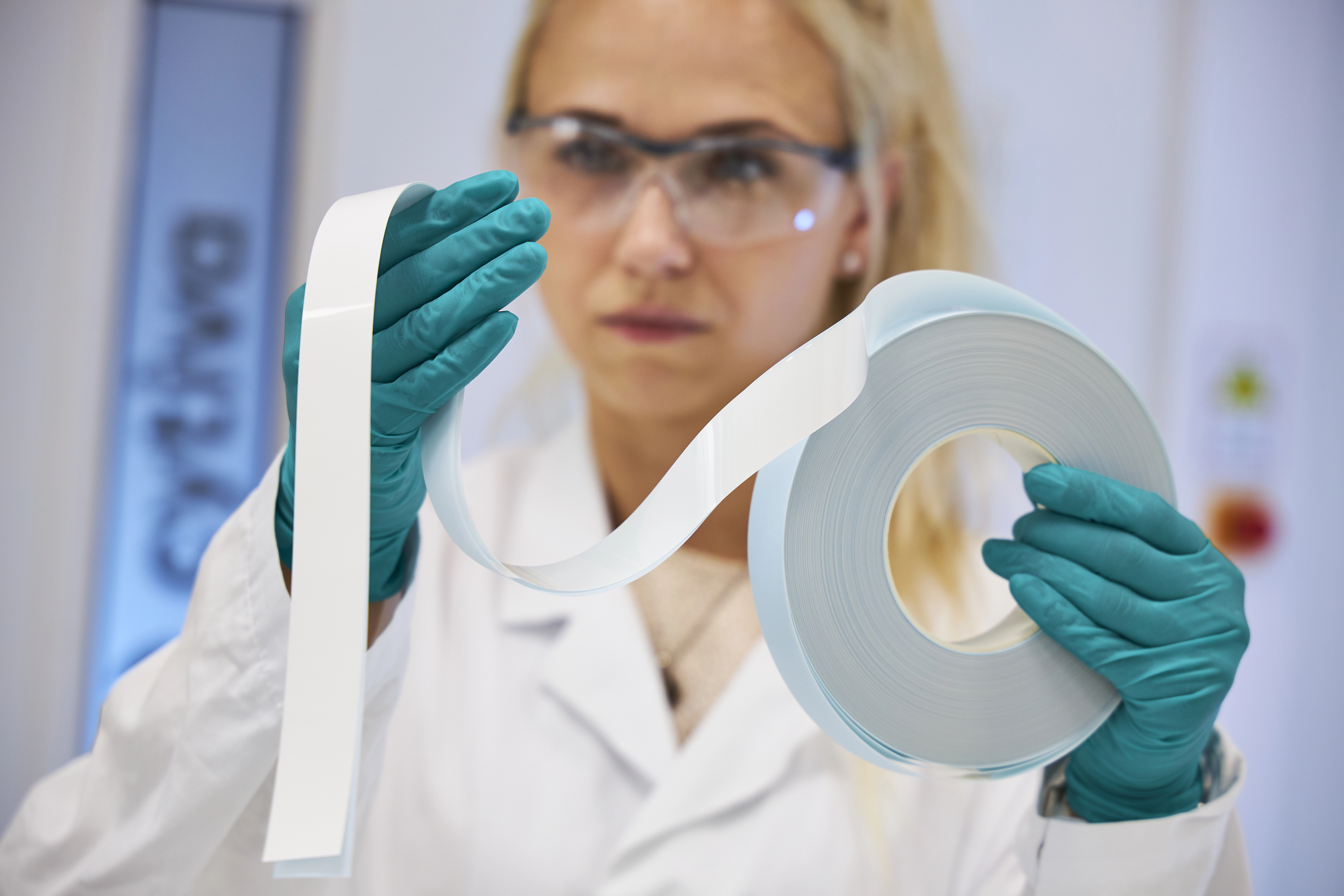 Scientist holding FFHP roll 1