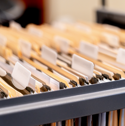 Open filing cabinets with multiple folders