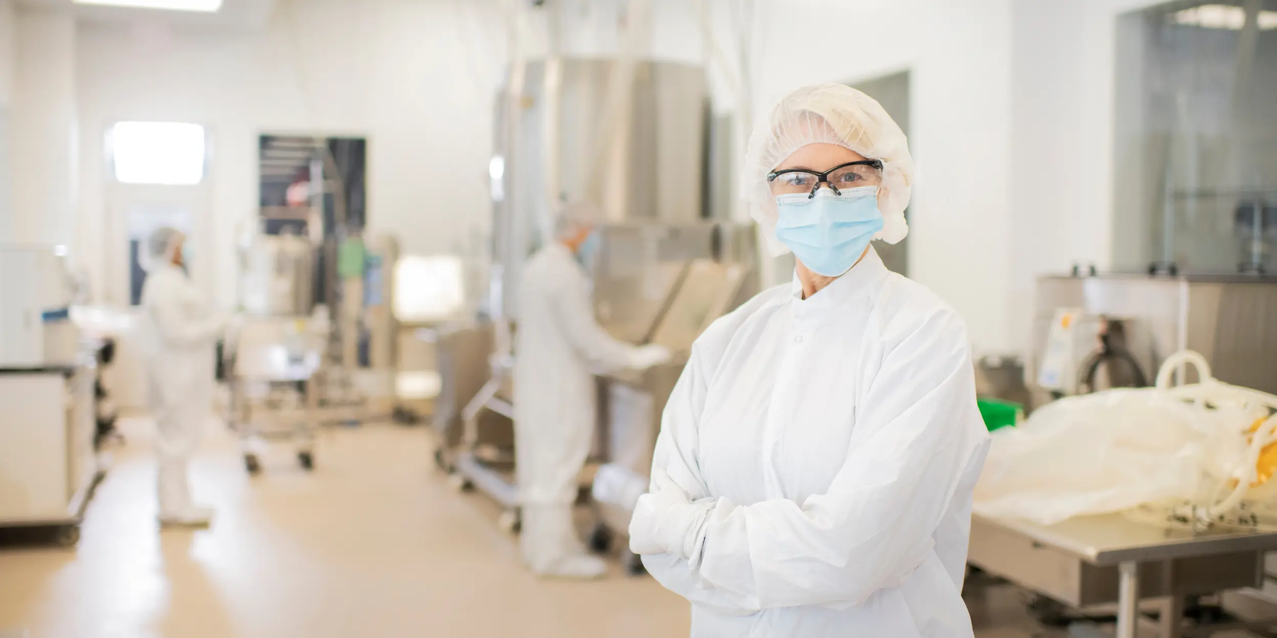 A scientist stands within a Cytiva bioprocessing laboratory