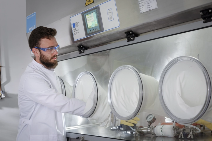 Performing sterilizing-grade filter validation in an isolator for controlled contamination-free processing
