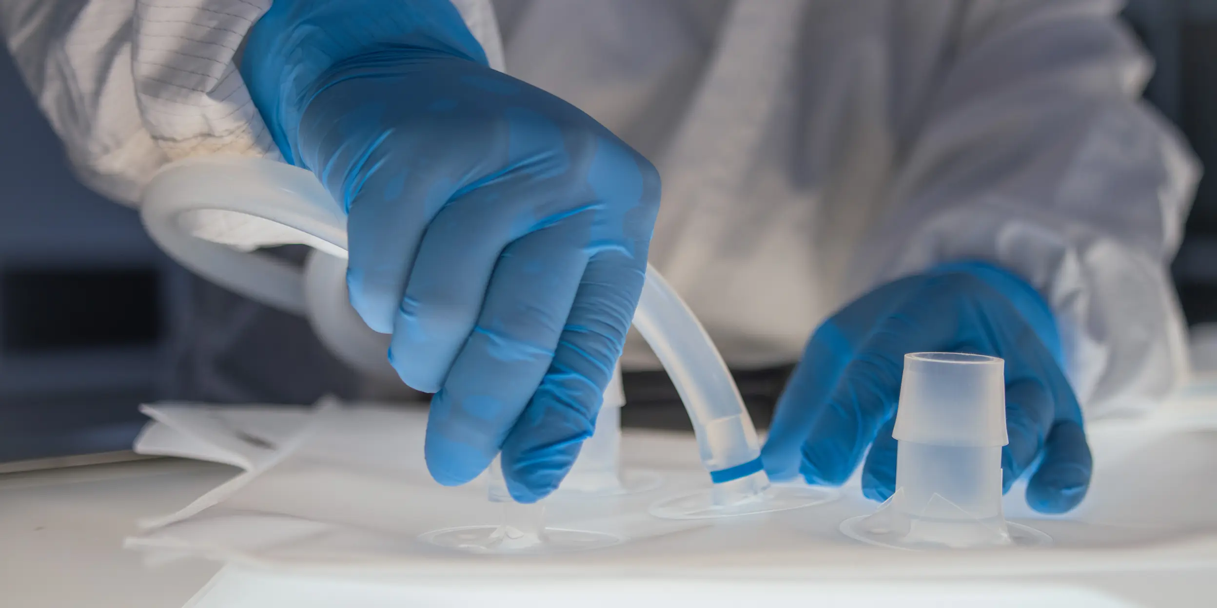 A lab technician assembling tubes to a single-use bag