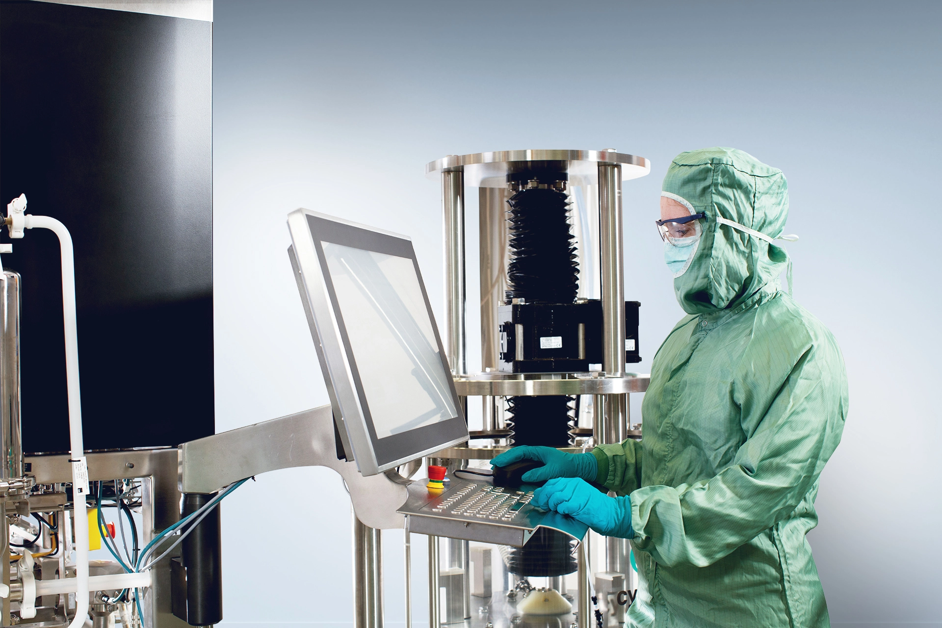 Process engineer working with ÄKTA process chromatography system and AxiChrom Column