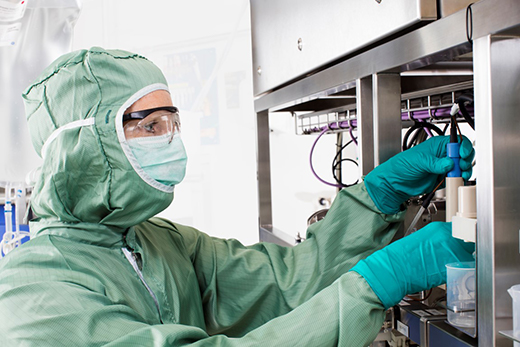 Scientists in clean room_HyClone buffers_process liquids_containers