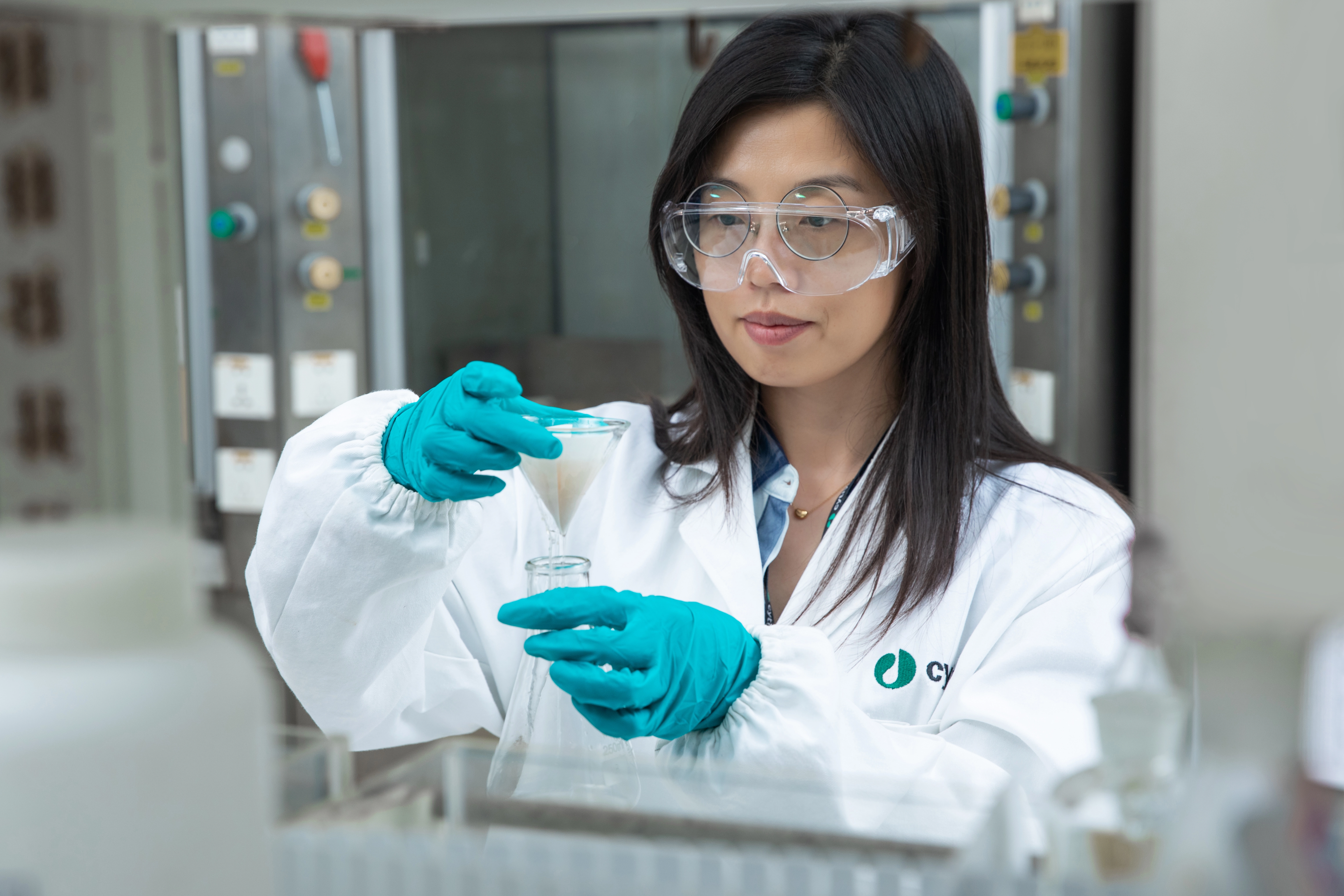 Scientist in lab with folded filter paper
