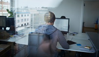 Man sitting in front of computer