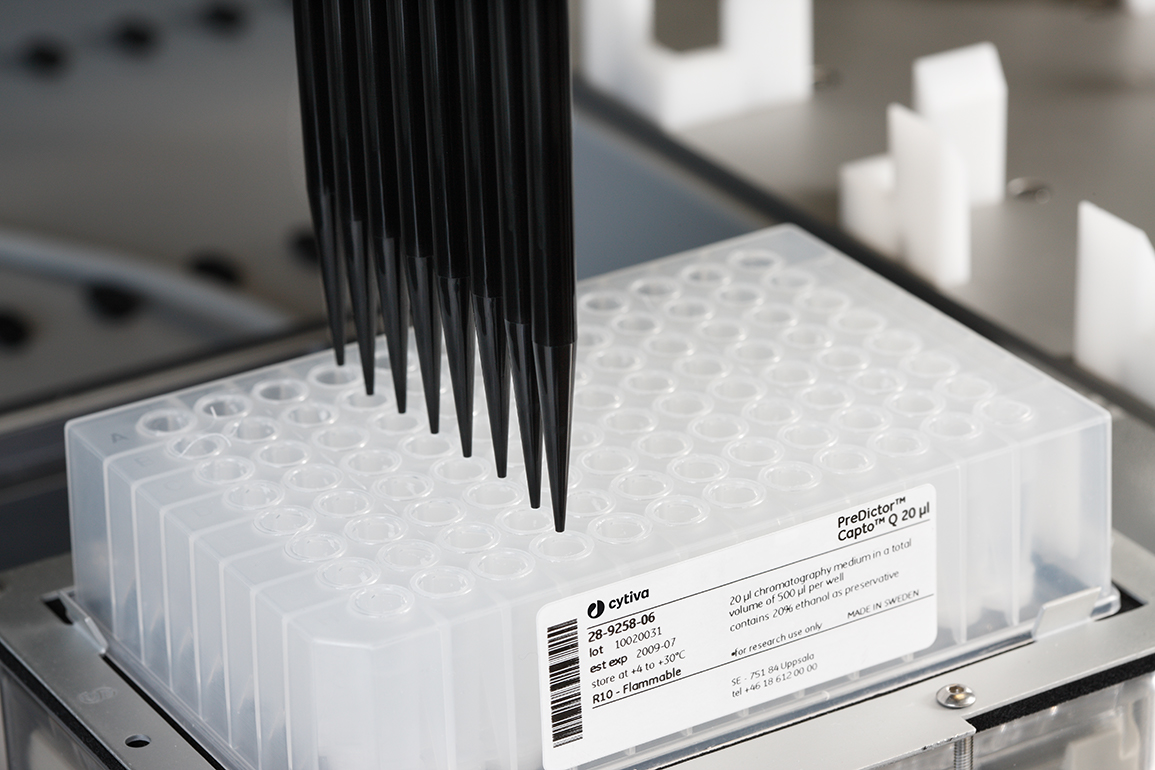 A lab robot executing high throughput process development (HTPD).
