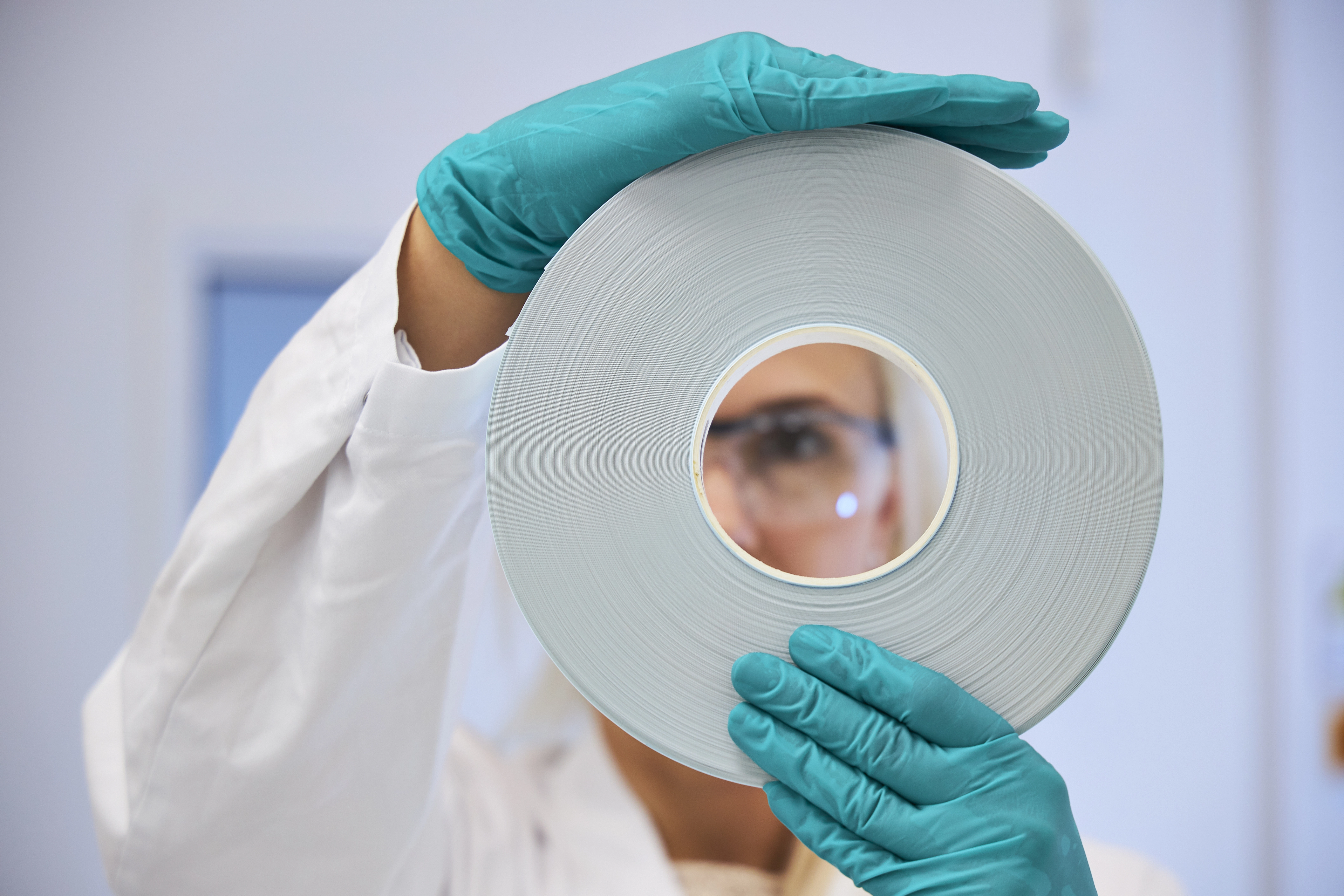 Scientist looking through membrane roll close-up